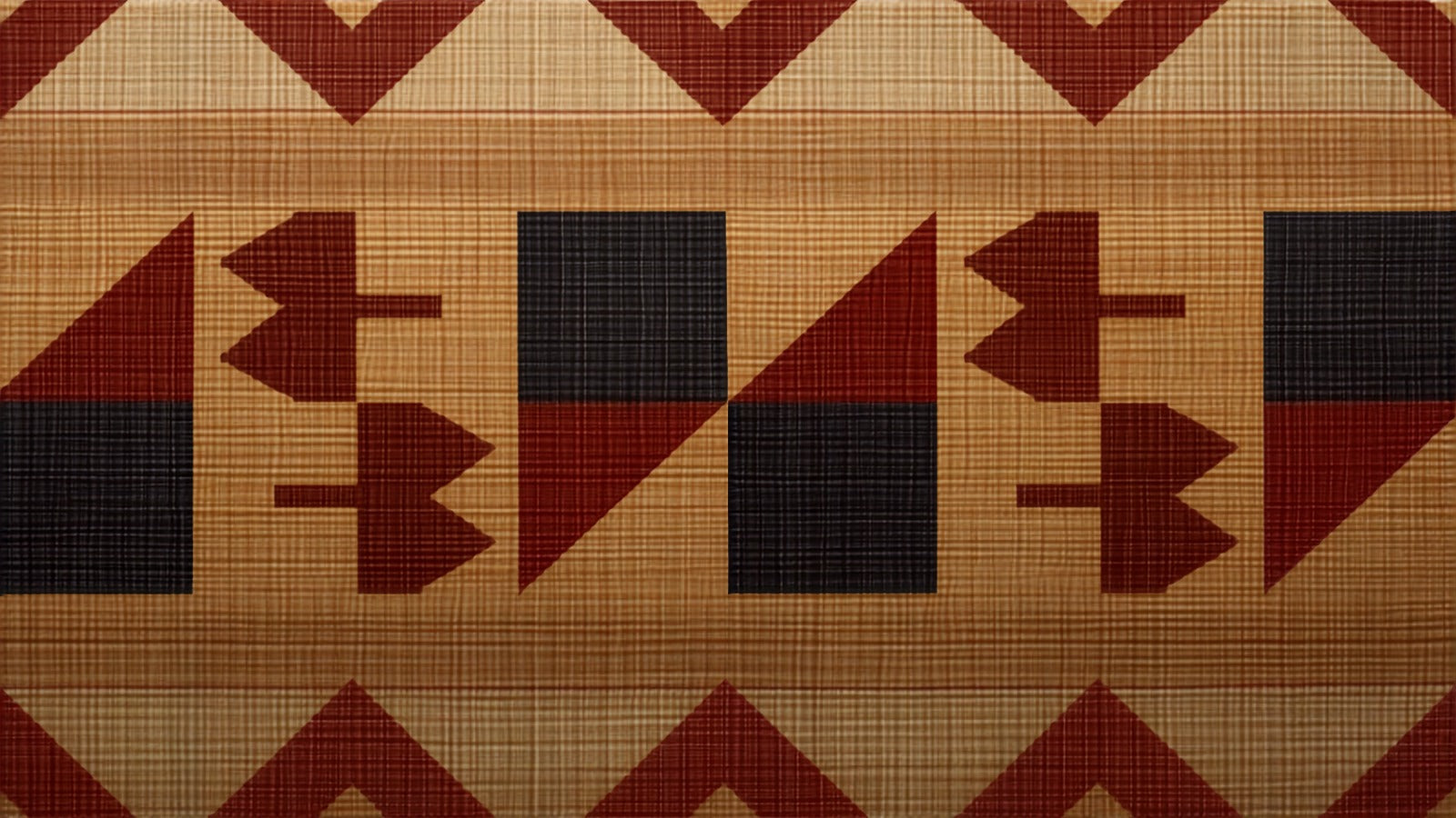 Traditional Hawaiian kapa barkcloth with geometric stamped patterns