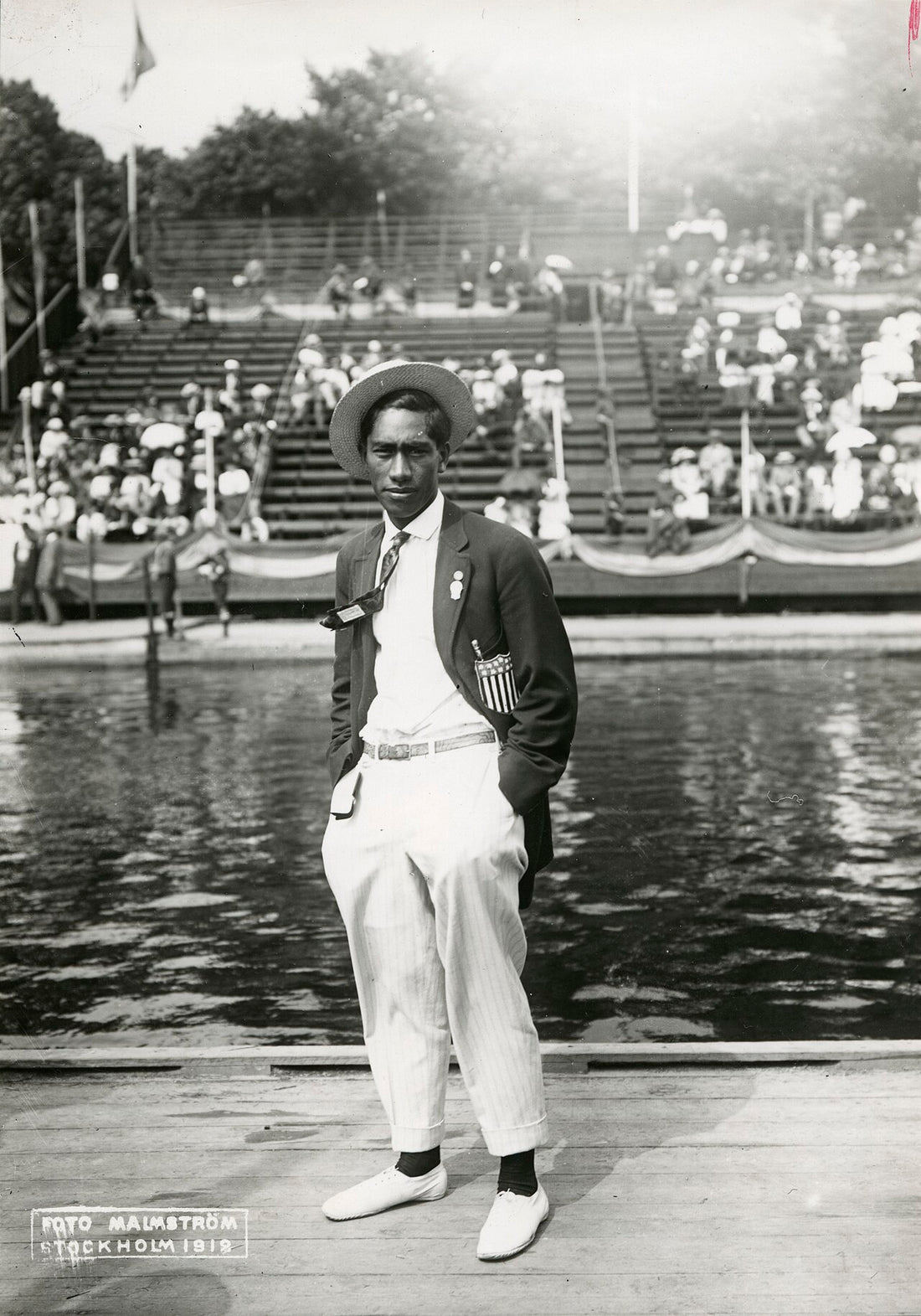 Duke Kahanamoku, the father of modern surfing, c.1912, with his surfboard
