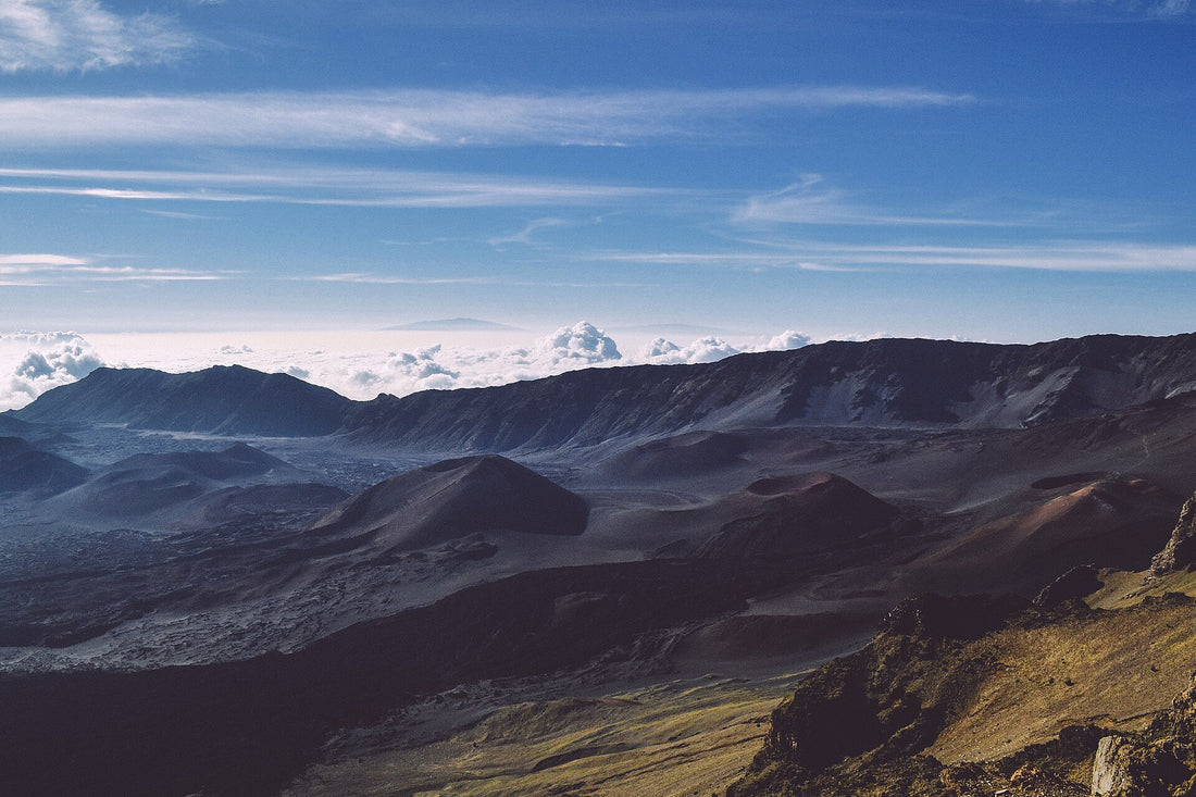 The Haleakalā summit crater with red cinder cones and a sea of clouds, Haleakalā National Park, Maui, Hawaiʻi