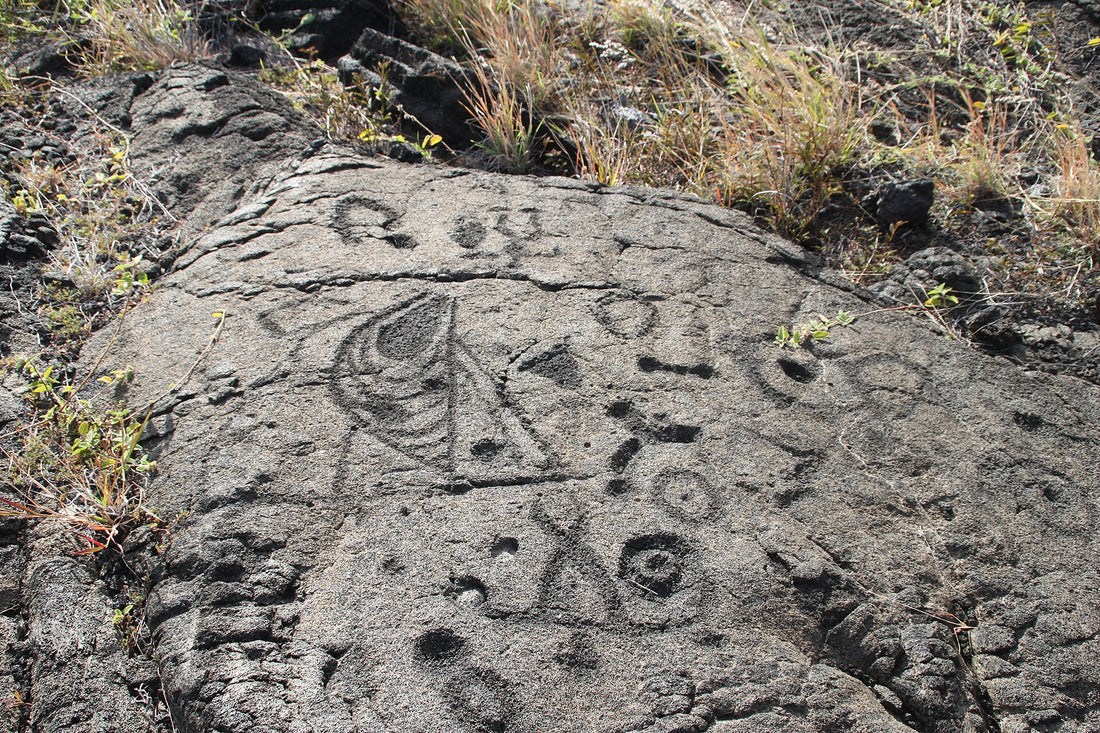 Ancient Hawaiian petroglyphs (kiʻi pōhaku) carved into pāhoehoe lava at Puʻuloa, Hawaiʻi Volcanoes National Park