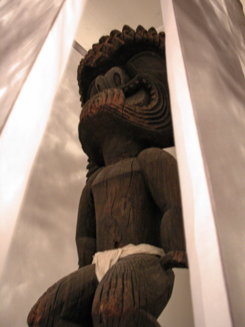Carved wooden kiʻi (tiki figure) of Kū, the Hawaiian god of war and prosperity, at the Bishop Museum in Hawaiʻi