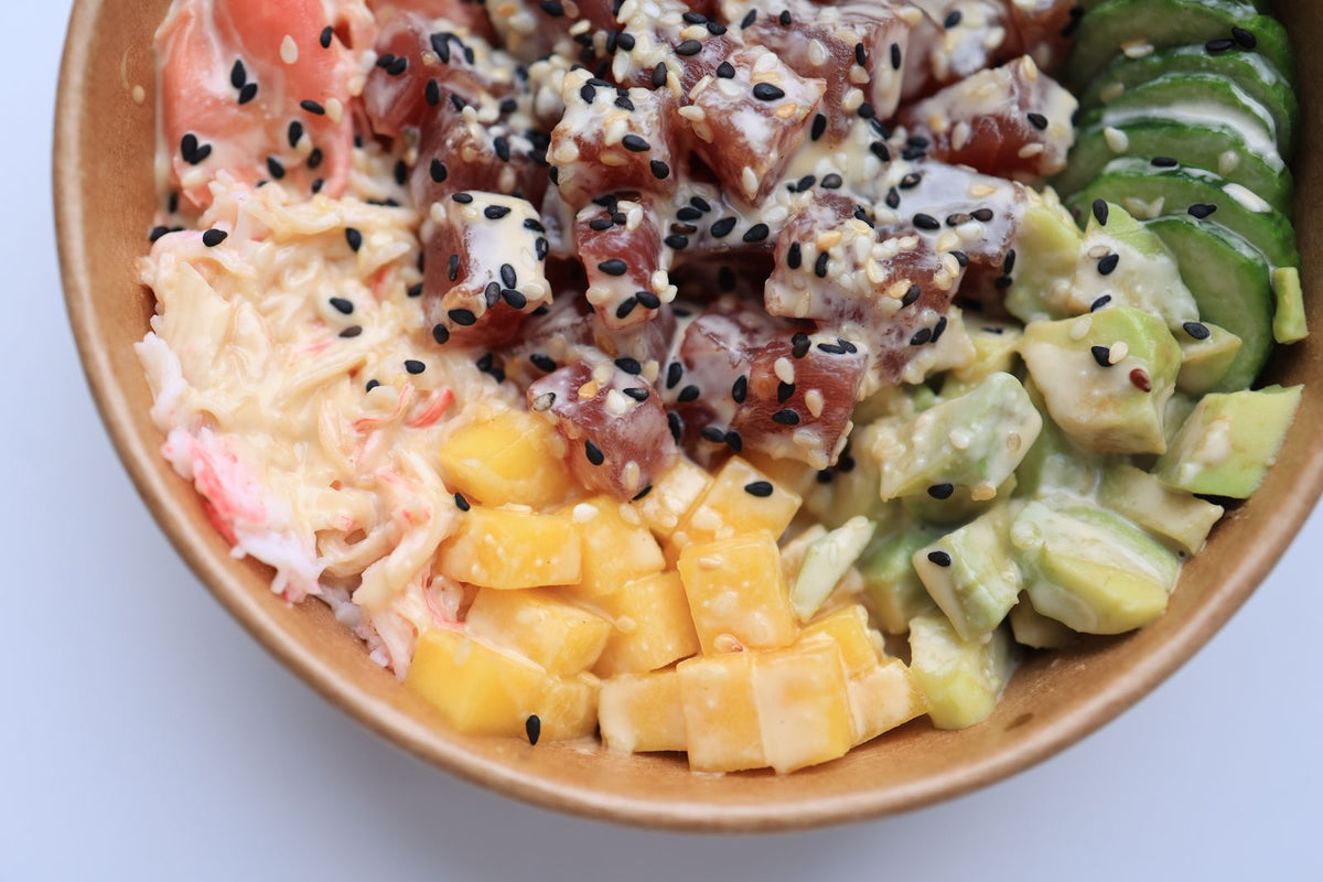Fresh ahi tuna poke bowl with mango, avocado, and cucumber, Hawaiʻi