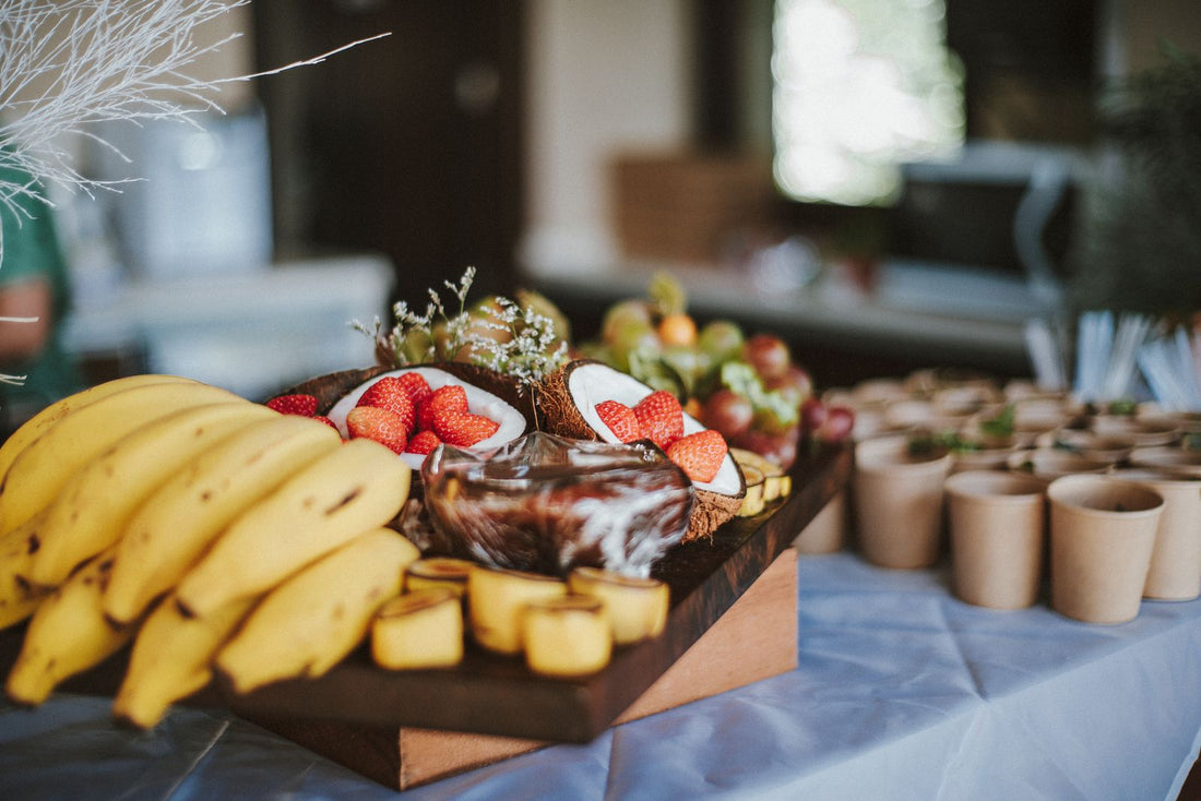 Tropical fruit and party food buffet spread for a Hawaiian luau in Hawaiʻi