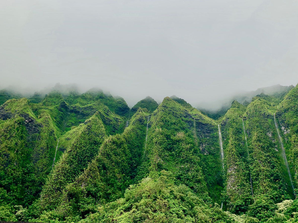 Misty, waterfall-streaked mountain ridge in Hawaiʻi