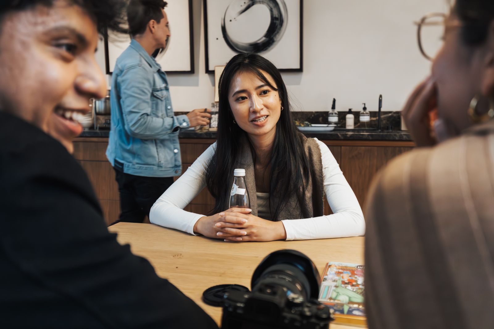 People talking story together at a table