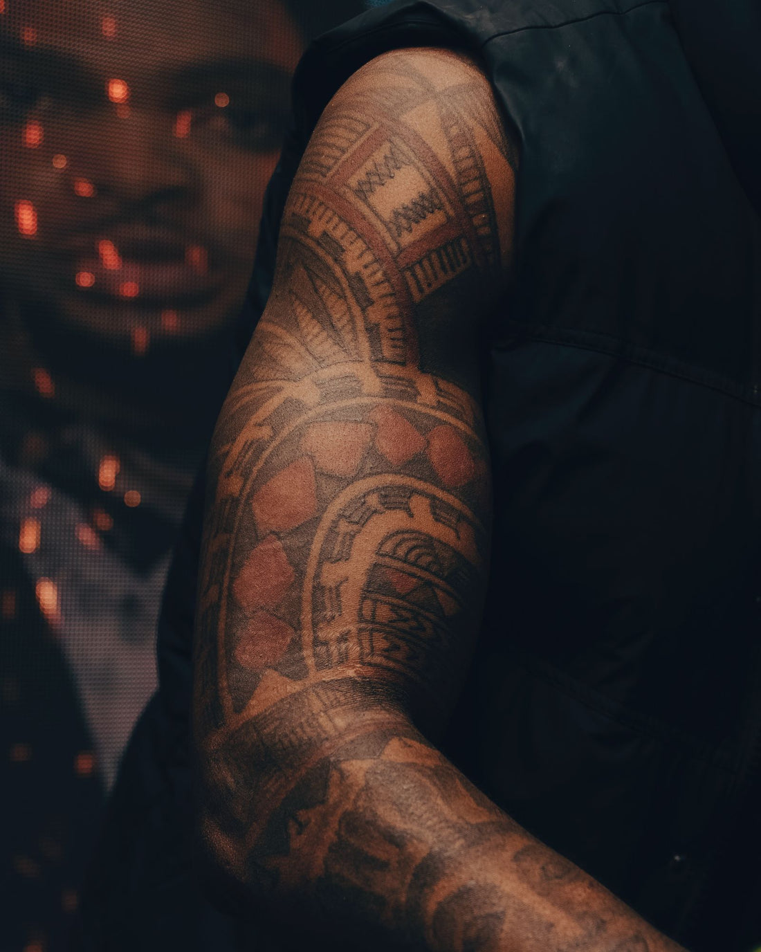 A bold Polynesian-style tattoo on a forearm, in the kakau tradition