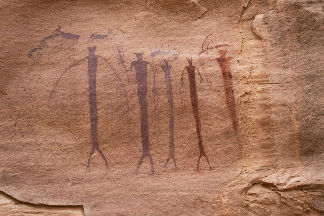 Ancient Hawaiian petroglyphs — human figures pecked into stone (kiʻi pōhaku)