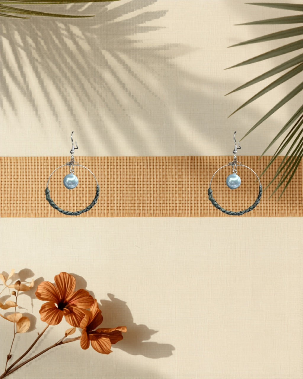 Lauhala half wrap silver hoop earrings Blue Shell Pearl variant styled on tropical Hawaiian background