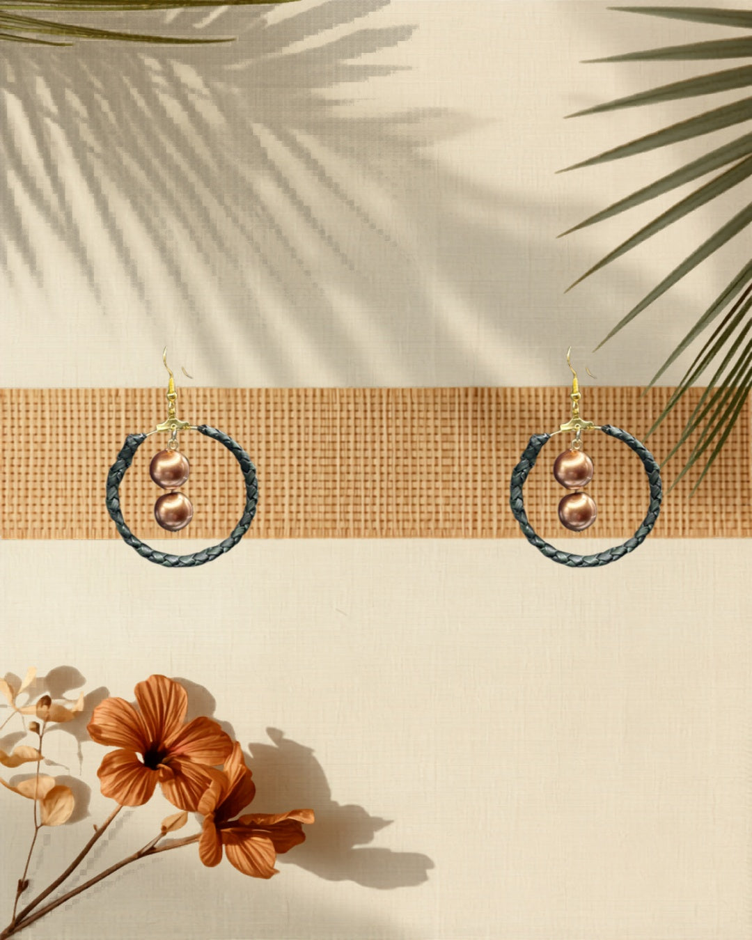 Lauhala double row gold hoop earrings Brown Shell Pearl variant styled on tropical Hawaiian background