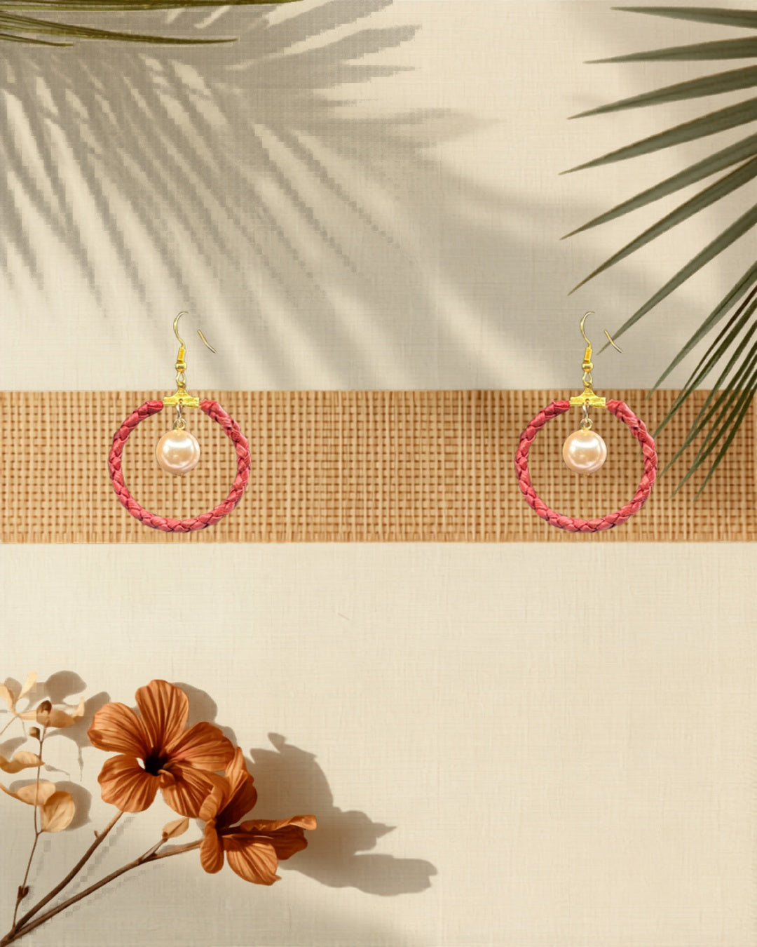 Lauhala full wrap hoop earrings Pink Shell Pearl Small variant styled on tropical Hawaiian background