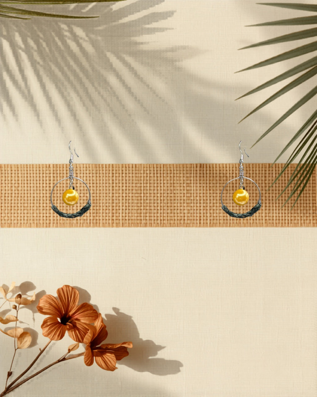 Lauhala half wrap silver hoop earrings Yellow Shell Pearl variant styled on tropical Hawaiian background
