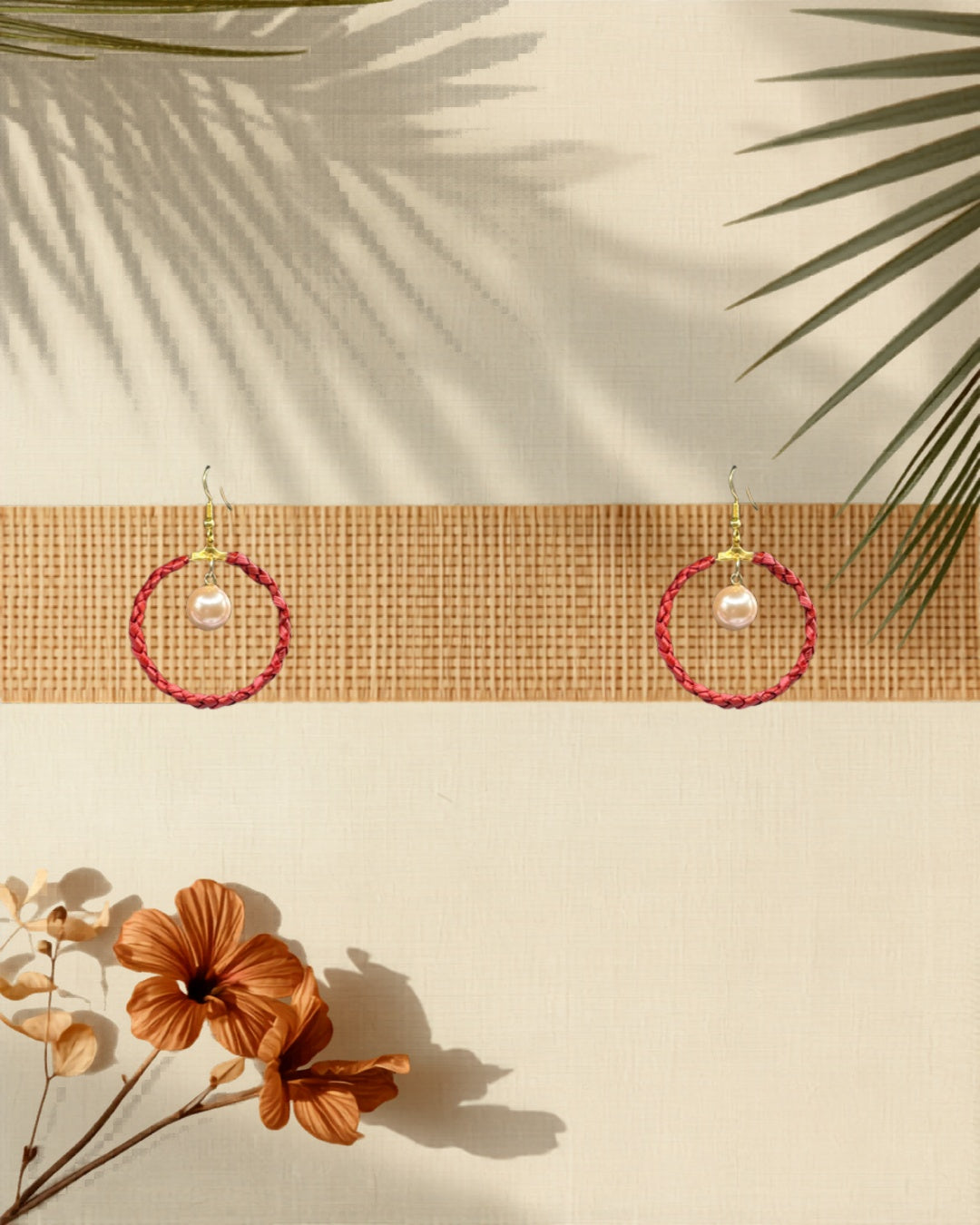 Lauhala full wrap hoop earrings Pink Shell Pearl Large variant styled on tropical Hawaiian background