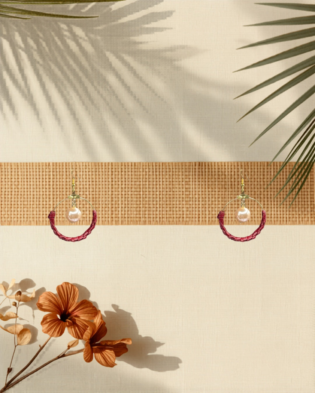 Lauhala half wrap gold hoop earrings styled on tropical Hawaiian background